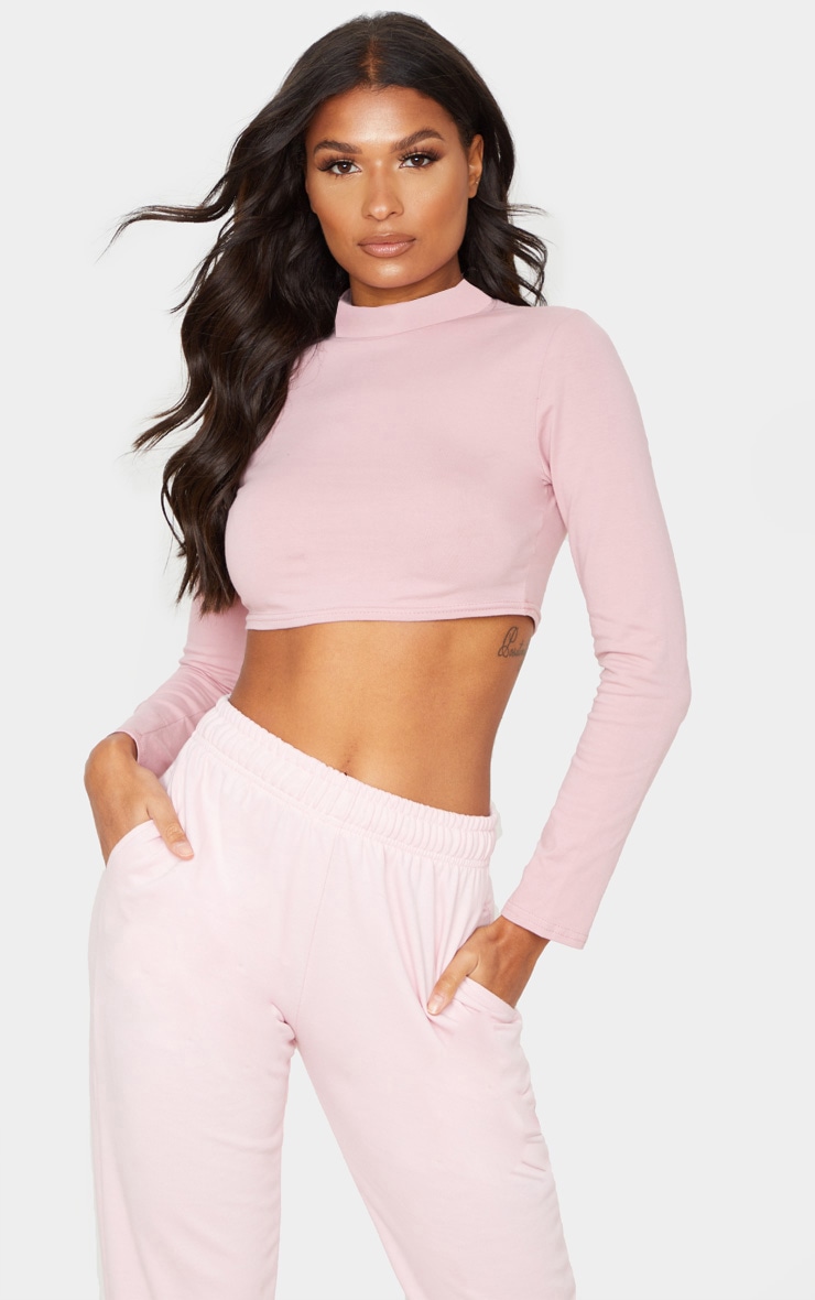 Crop top rose pâle à col montant et manches longues