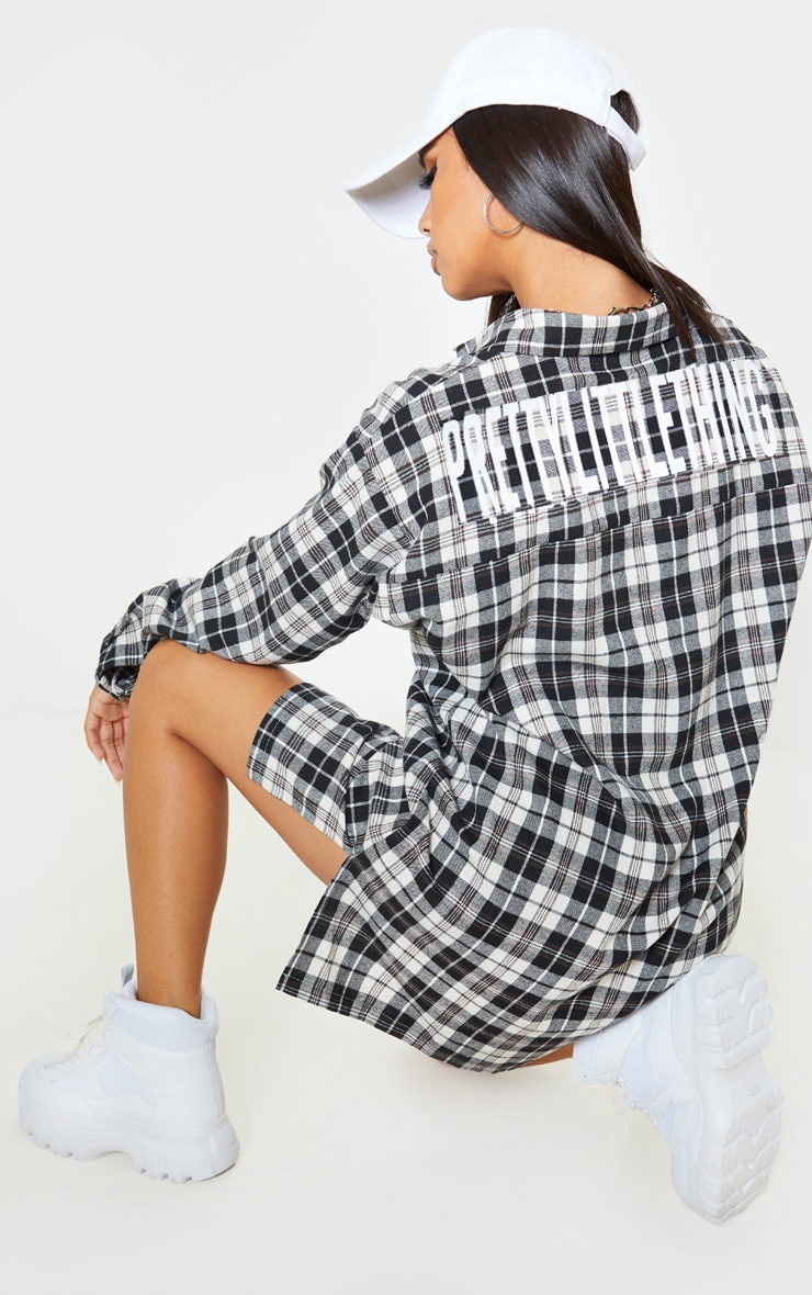 PRETTYLITTLETHING Black Slogan Checked Shirt Dress