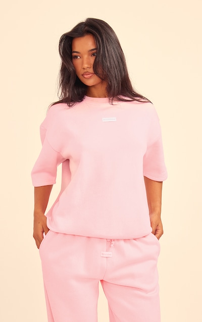 PRETTYLITTLETHING Baby Pink Badge Detail Oversized Short Sleeve Sweatshirt
