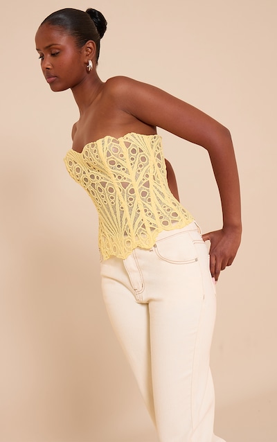 Corset en dentelle texturée jaune beurre transparente fleurie