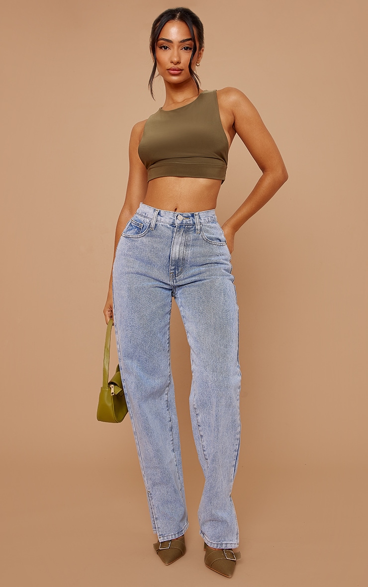 A fresh take on denim, these light blue jeans offer a subtle elevation to your casual repertoire. Crafted from quality denim, the clean lines are punctuated by a contemporary split hem detail. The high-waisted silhouette flatters the petite frame, creating a streamlined profile. Style yours with a tucked-in knit and sculptural heels for an effortless day-to-night transition. Discover our range of trousers for alternative styling options. Length approx 66cm/26