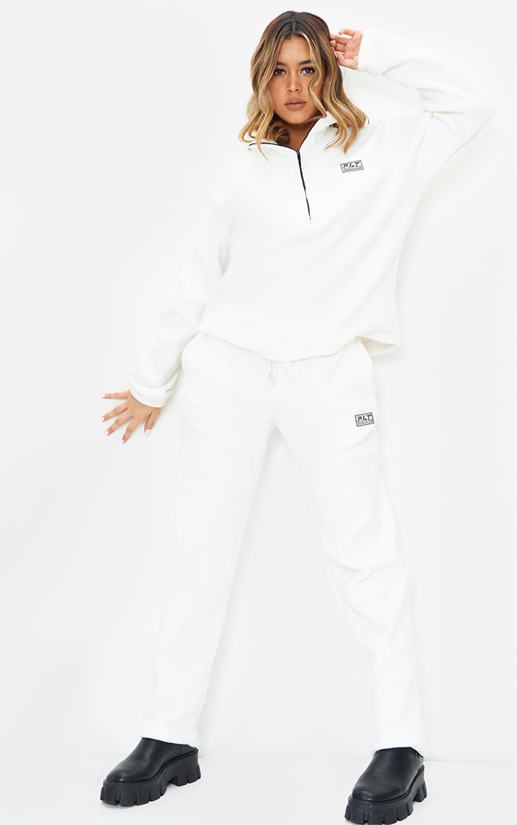 PRETTYLITTLETHING Cream Soft Touch Badge Detail Straight Leg Joggers