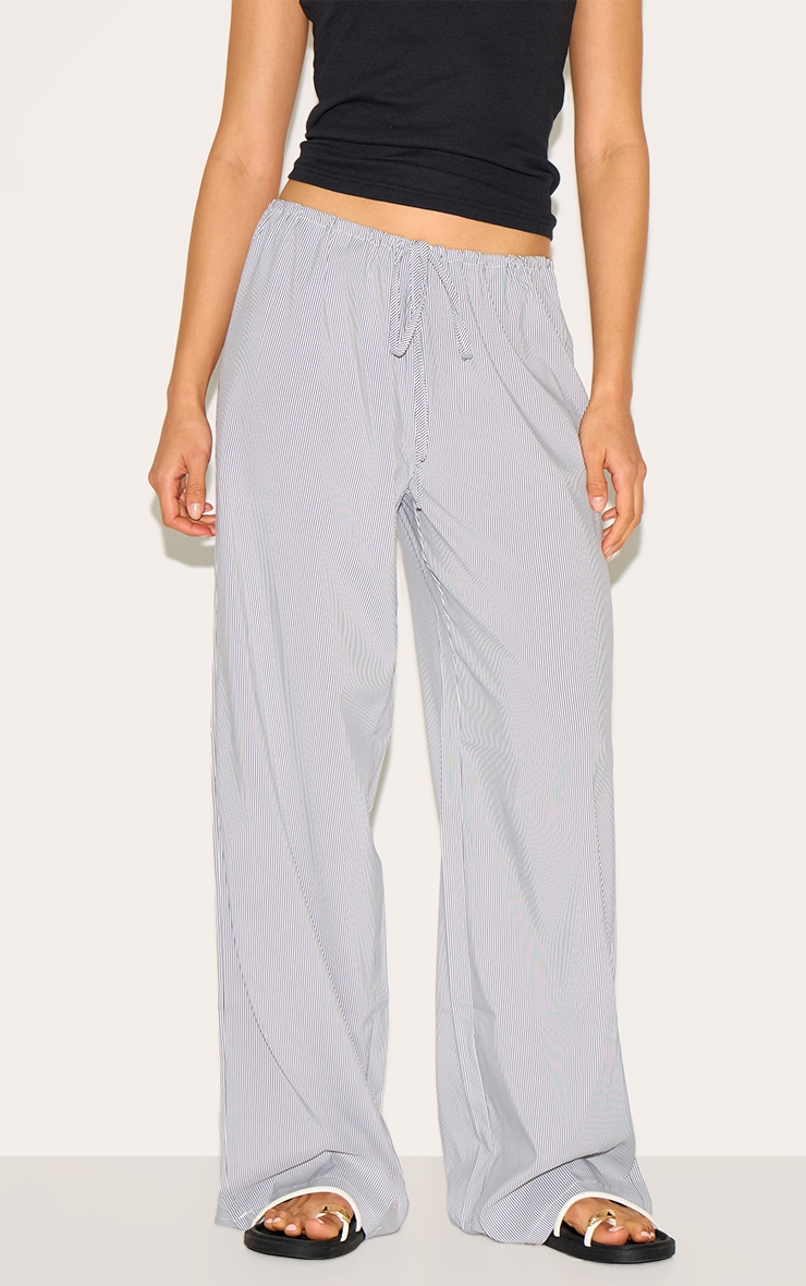 Pantalon taille basse noir à rayures fines et cordons ajustables image 1
