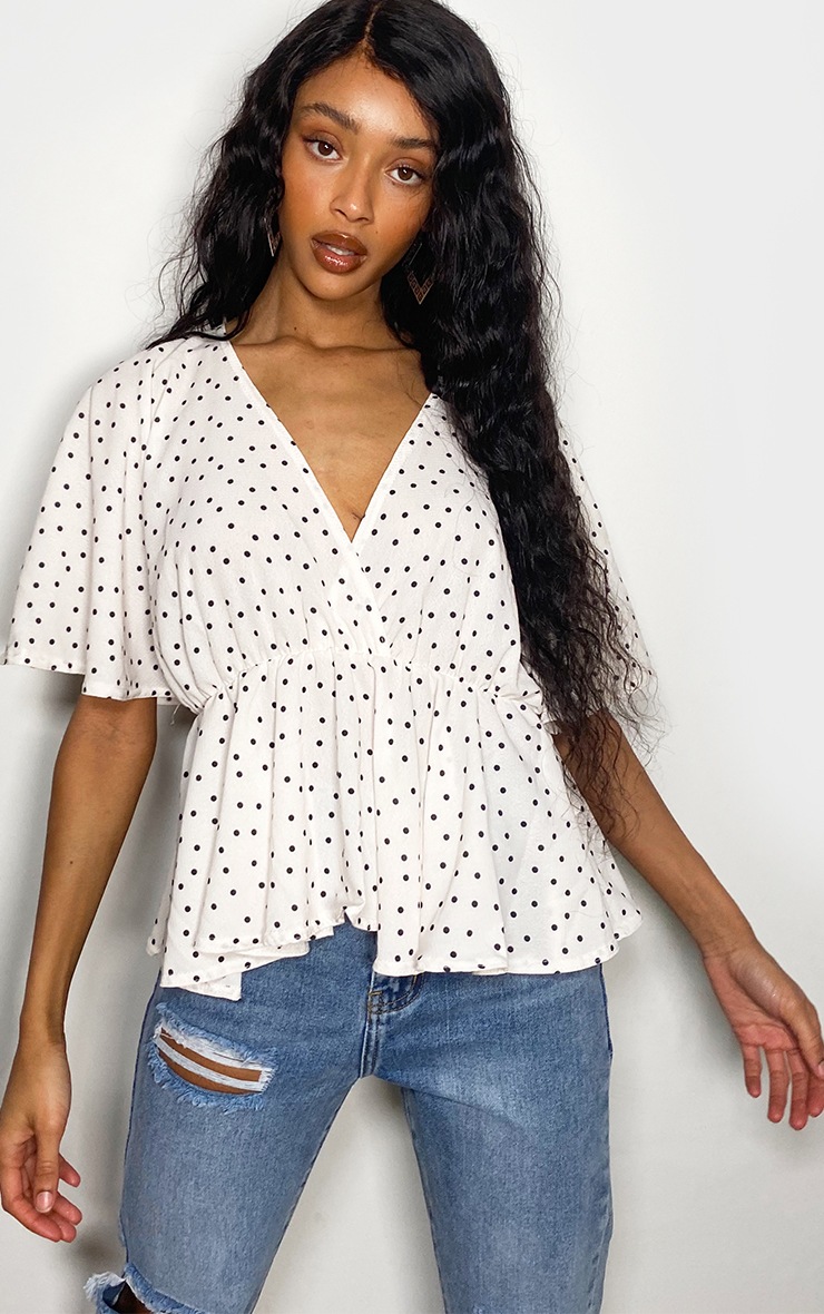 Blouse blanche volantée à pois
