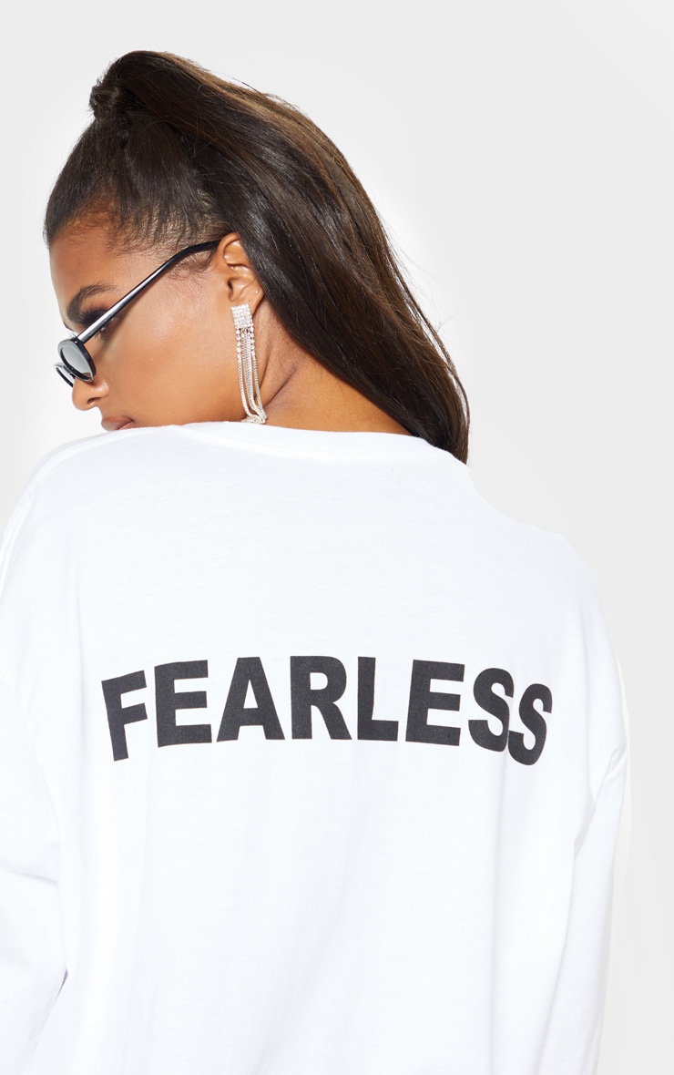 T-shirt manches longues blanc à slogan Fearless au dos