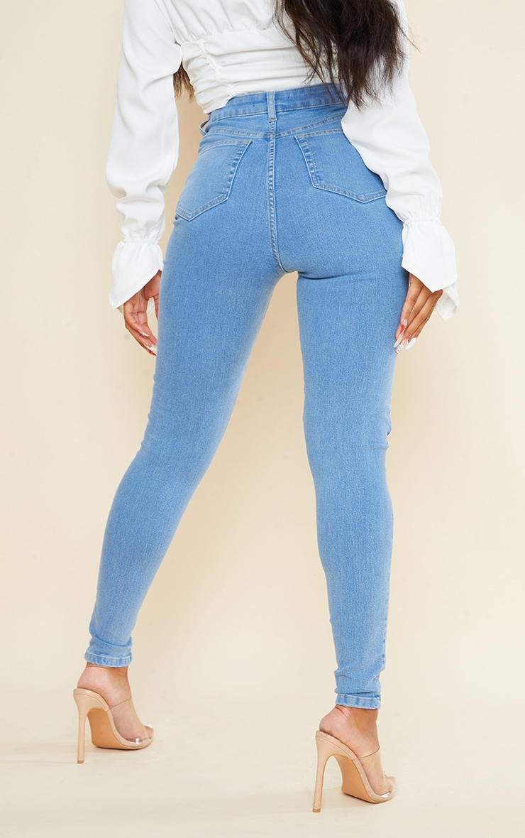 PRETTYLITTLETHING Light Wash 5 Pocket Knee Rip Skinny Jeans image 3