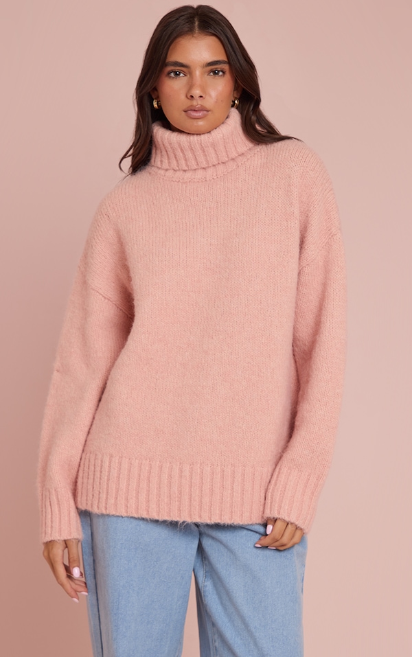 Pull oversize rose à col roulé et manches ballon