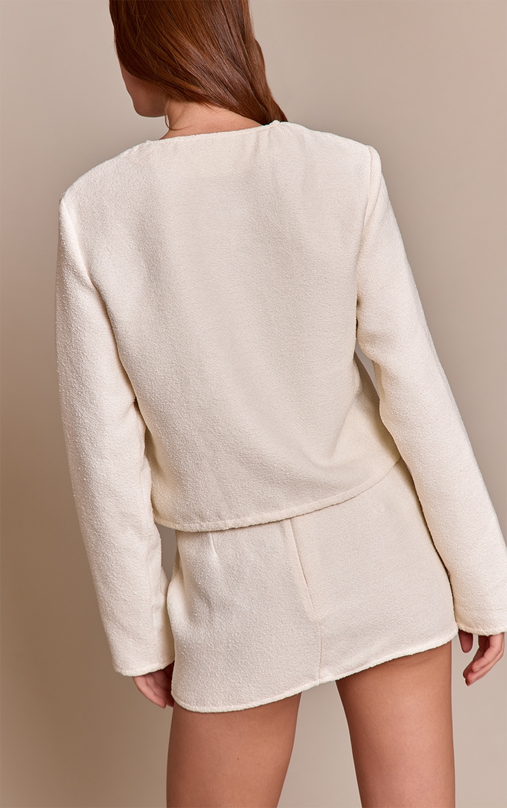 Mini-jupe bouclée crème à taille mi-haute image 3