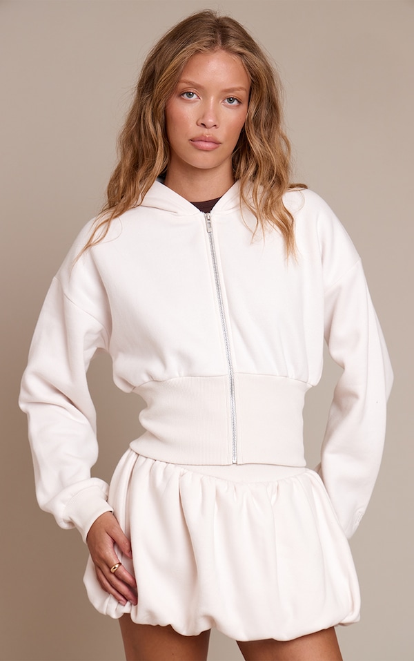 Mini-jupe bouffante en sweat crème à doublure en polaire