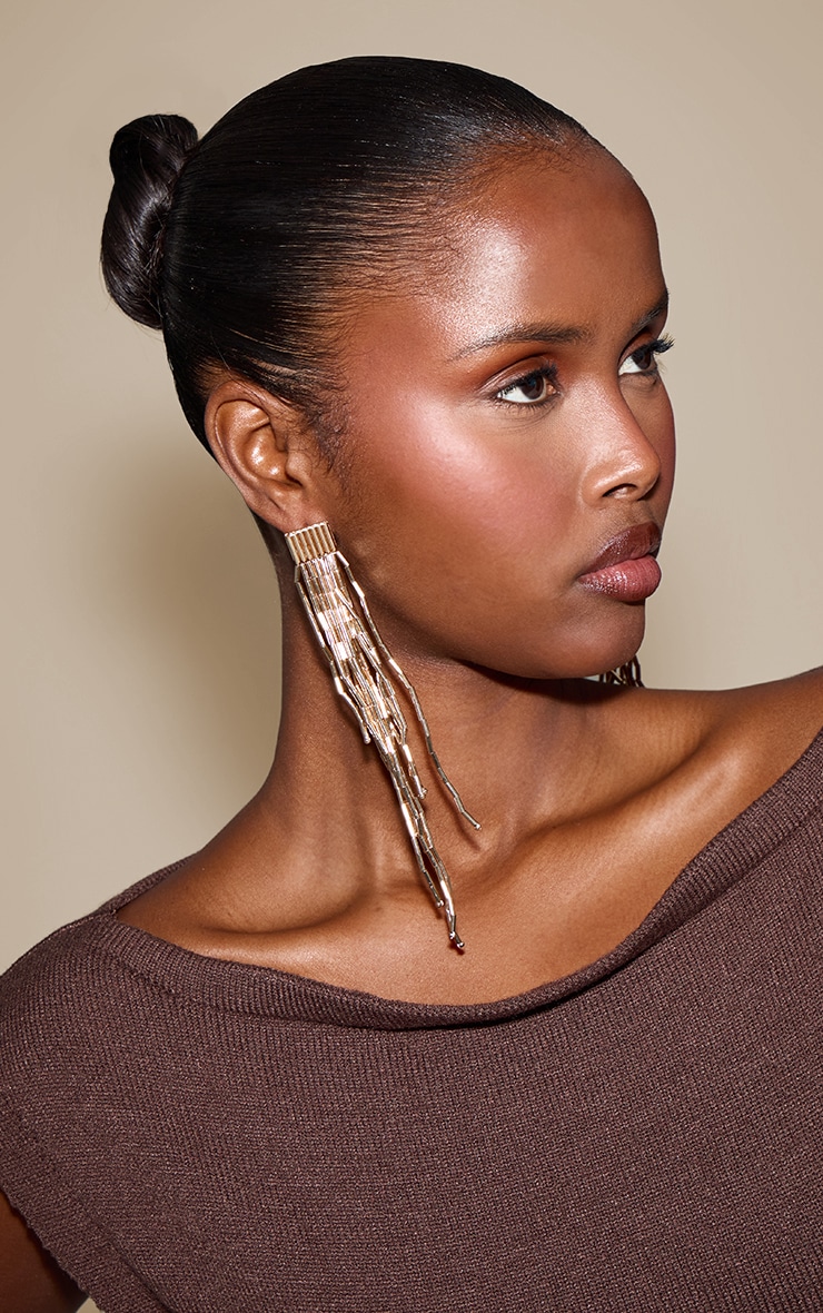 Boucles d'oreilles imposantes tombantes dorées à franges image 1