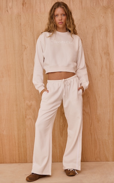 Jogging large crème imprimé "Sports Club