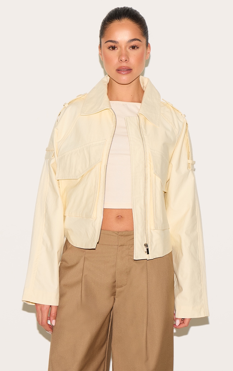 Veste courte crème au beurre à détails trench et zip image 1