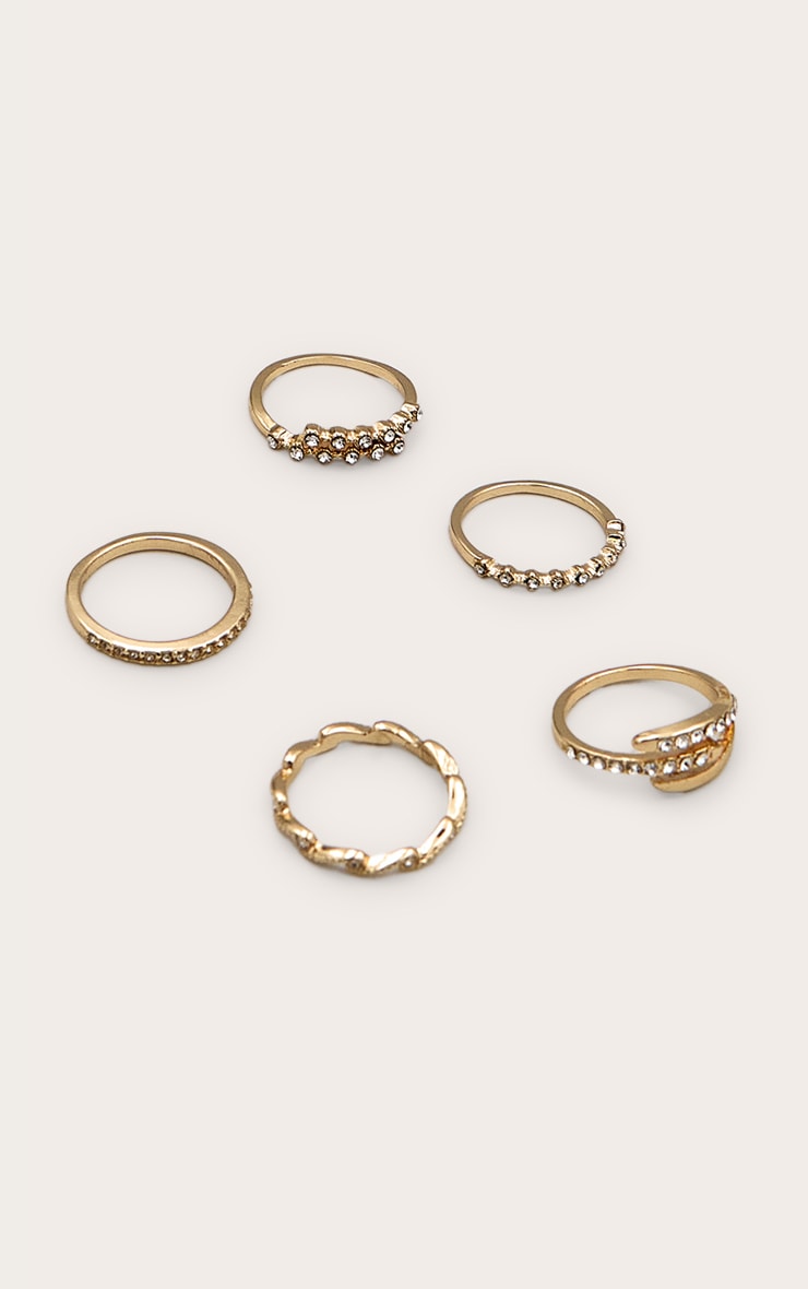 Assortiment de 5 bagues dorées strassées image 1