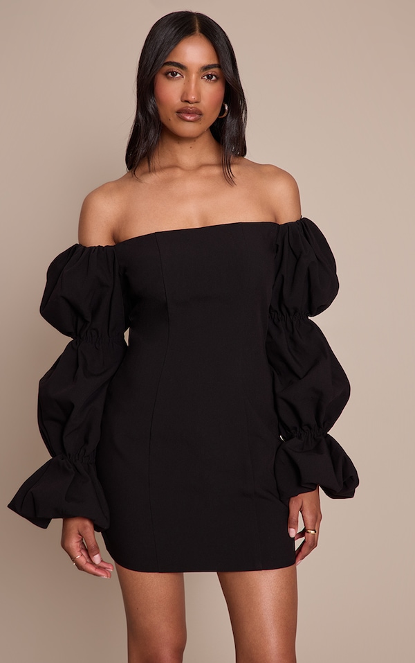 Robe moulante noire à col bardot et manches bouffantes