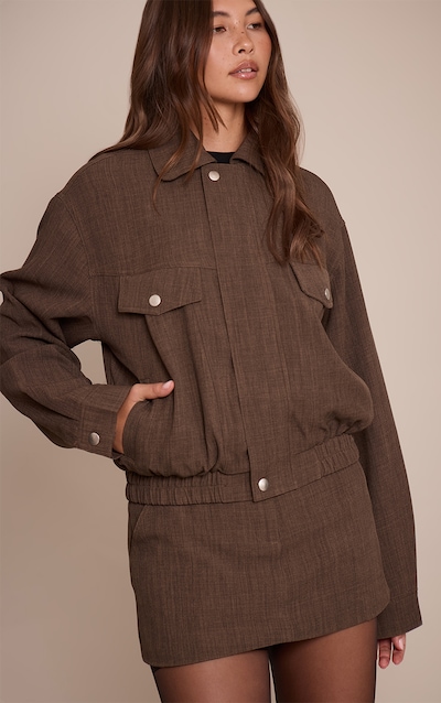 Veste de tailleur tissée taupe à poches oversize et lisérés structurants