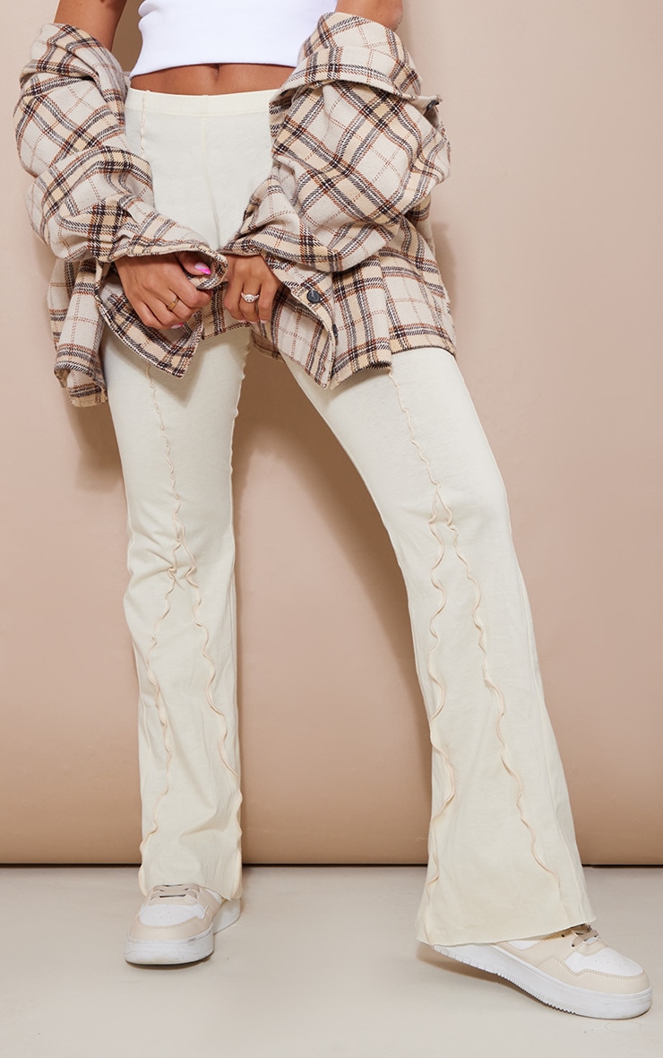 Cream Split Seam Lettuce Hem Flare Trousers PrettyLittleThing USA