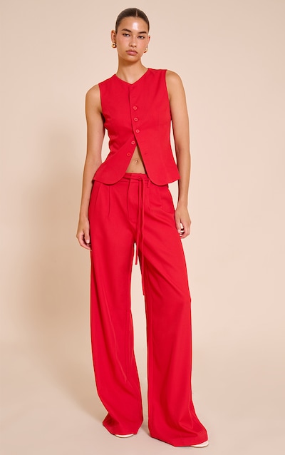 Pantalon de tailleur large tissé rouge tomate à détail noué