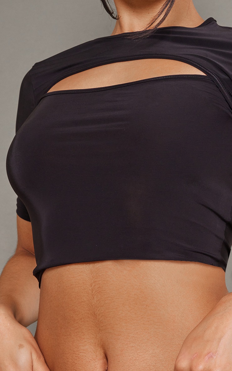 Crop top moulant noir découpé à manche unique | FR