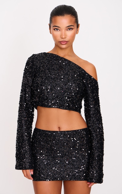 Top texturé noir à sequins et manches longues