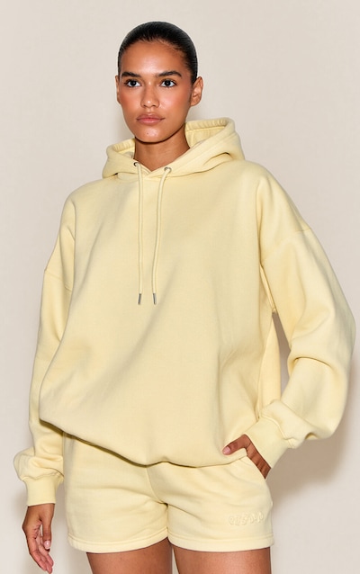 Short en sweat crème au beurre à cordons ajustables et imprimé en relief "PLT Studio