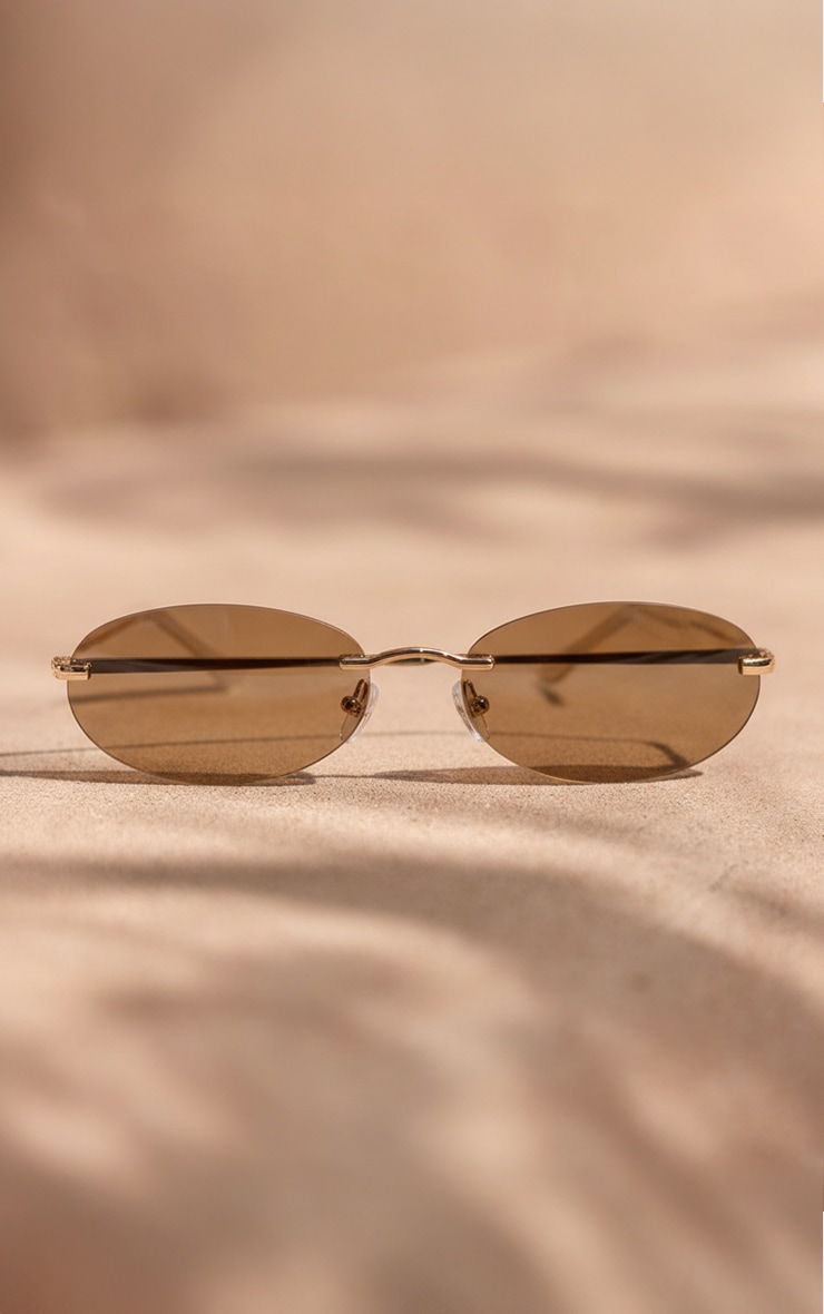 Gold Rimless Brown Lens Oval Sunglasses