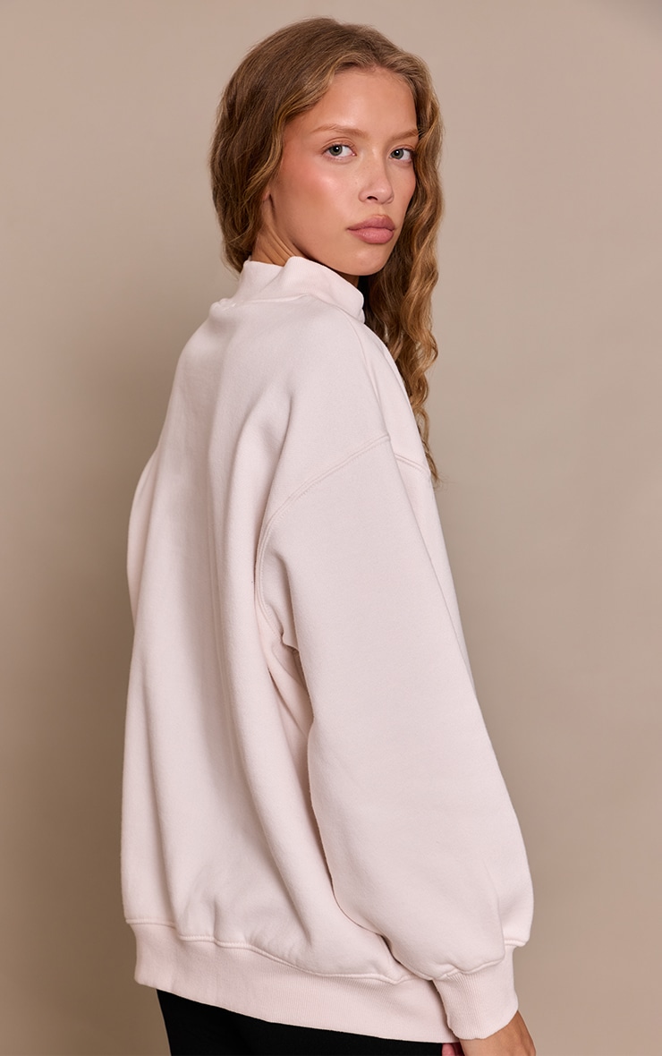 Sweat en coton polaire crème à col croisé devant image 2