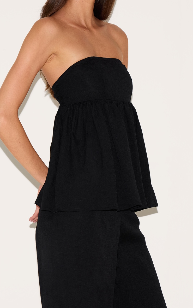 Combinaison bustier noire à détail péplum image 4