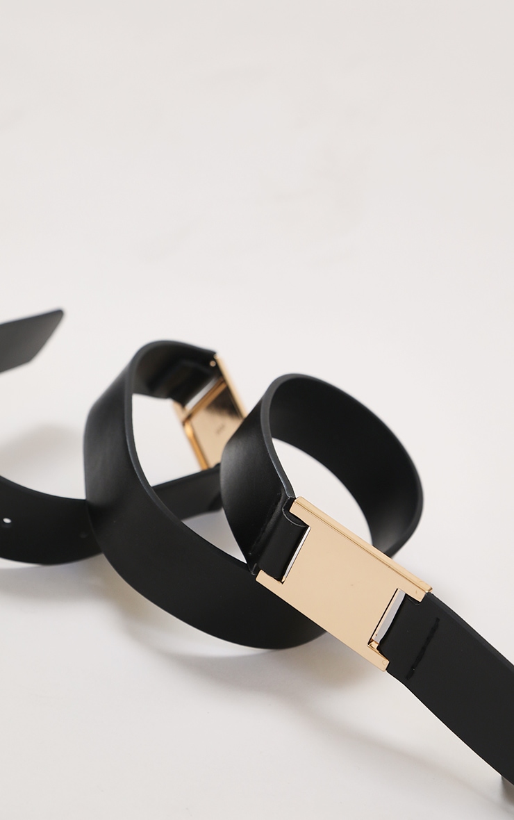 black belt with gold square buckle