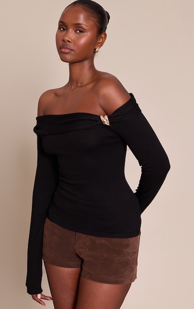 Top en maille tricot noire à épaules torsadéess et manches longues