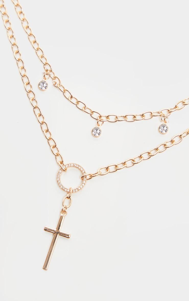 Ras-de-cou doré à pendentifs croix et strass