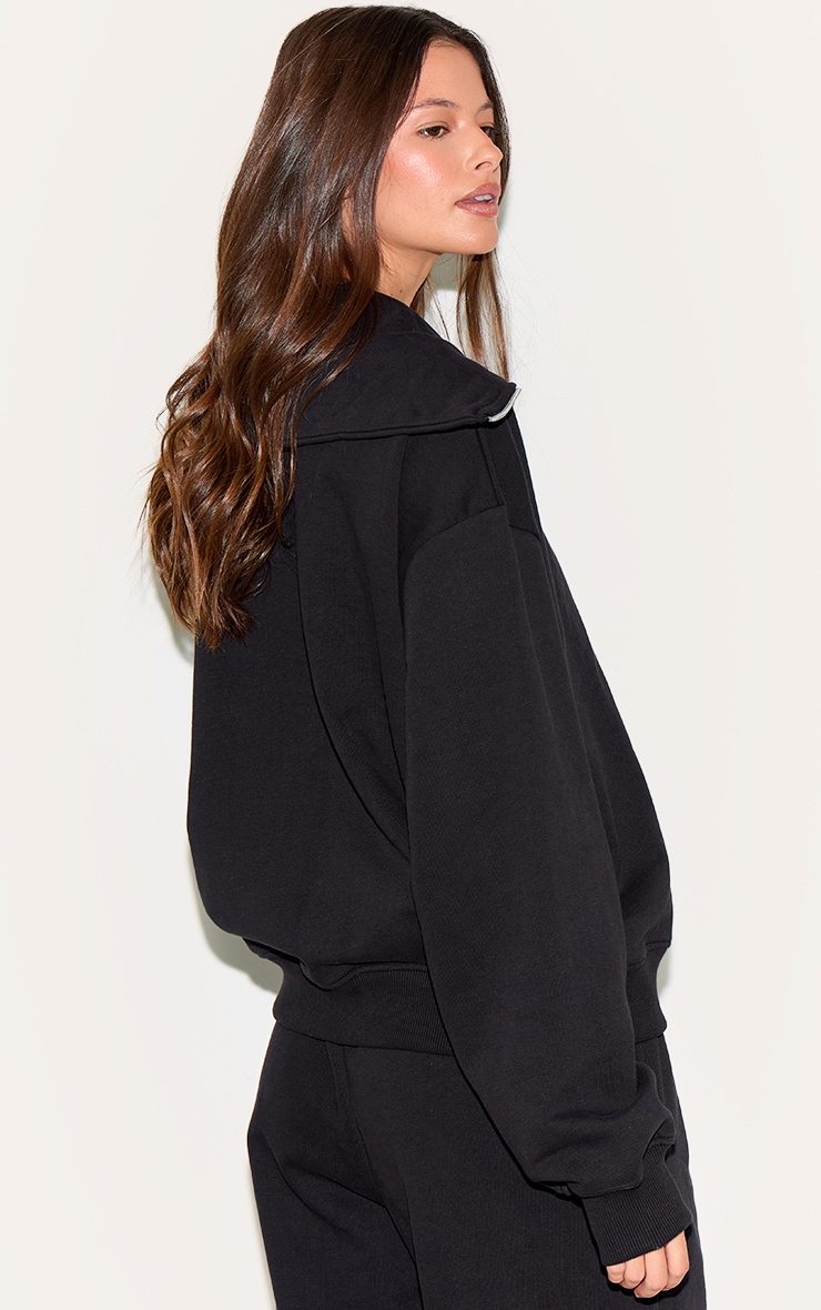 Sweat deluxe noir doublé en polaire à col replié et quart de zip image 2