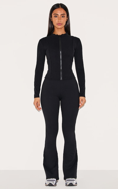 Petite Pantalon en Sculpt noir à contours et taille repliée