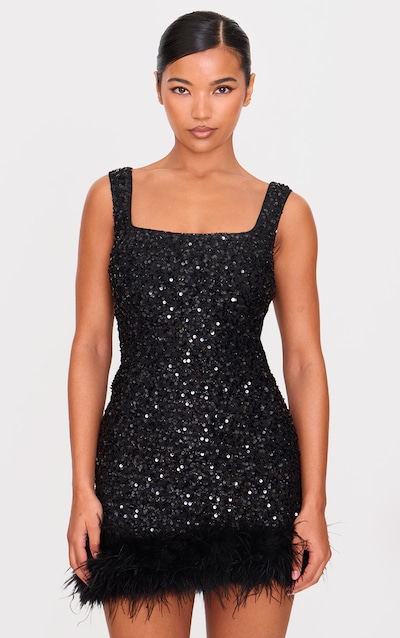 Robe droite col rond noire à sequins et ourlet en plumes