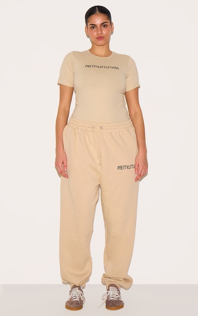 PRETTYLITTLETHING Plus Jogging avoine à taille haute et ourlets retroussés