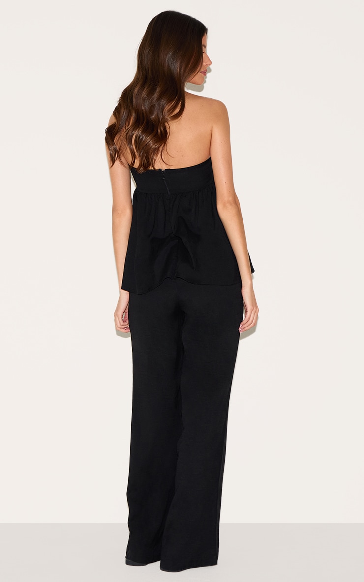 Combinaison bustier noire à détail péplum image 2