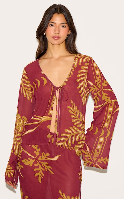 Top marron transparent fleuri noué devant à manches longues