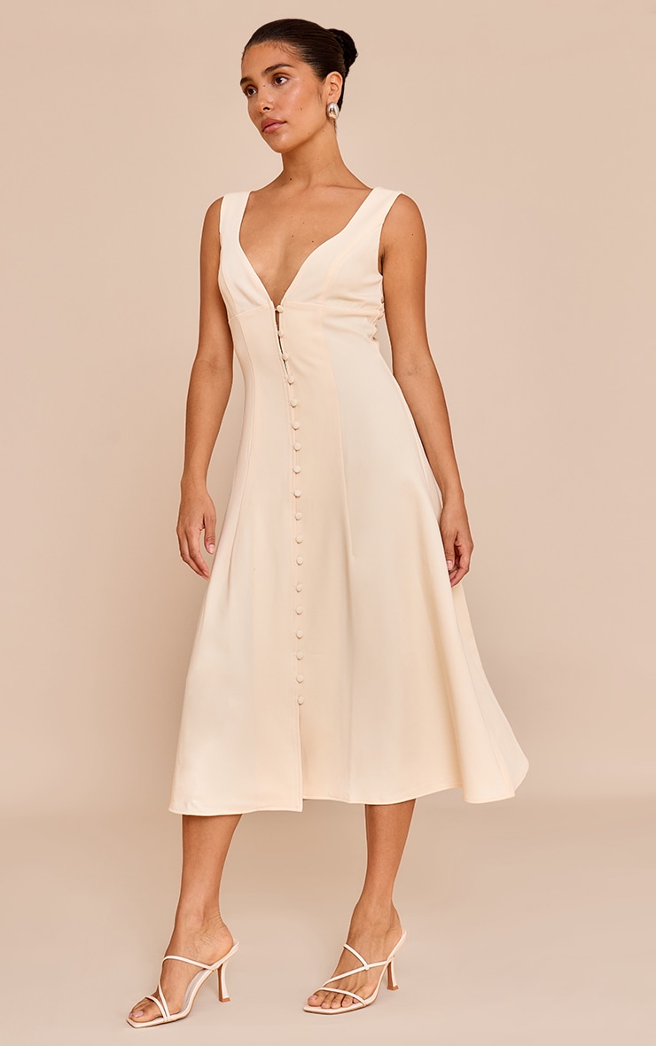 Petite Robe mi-longue crème au beurre à décolleté et boutons image 1