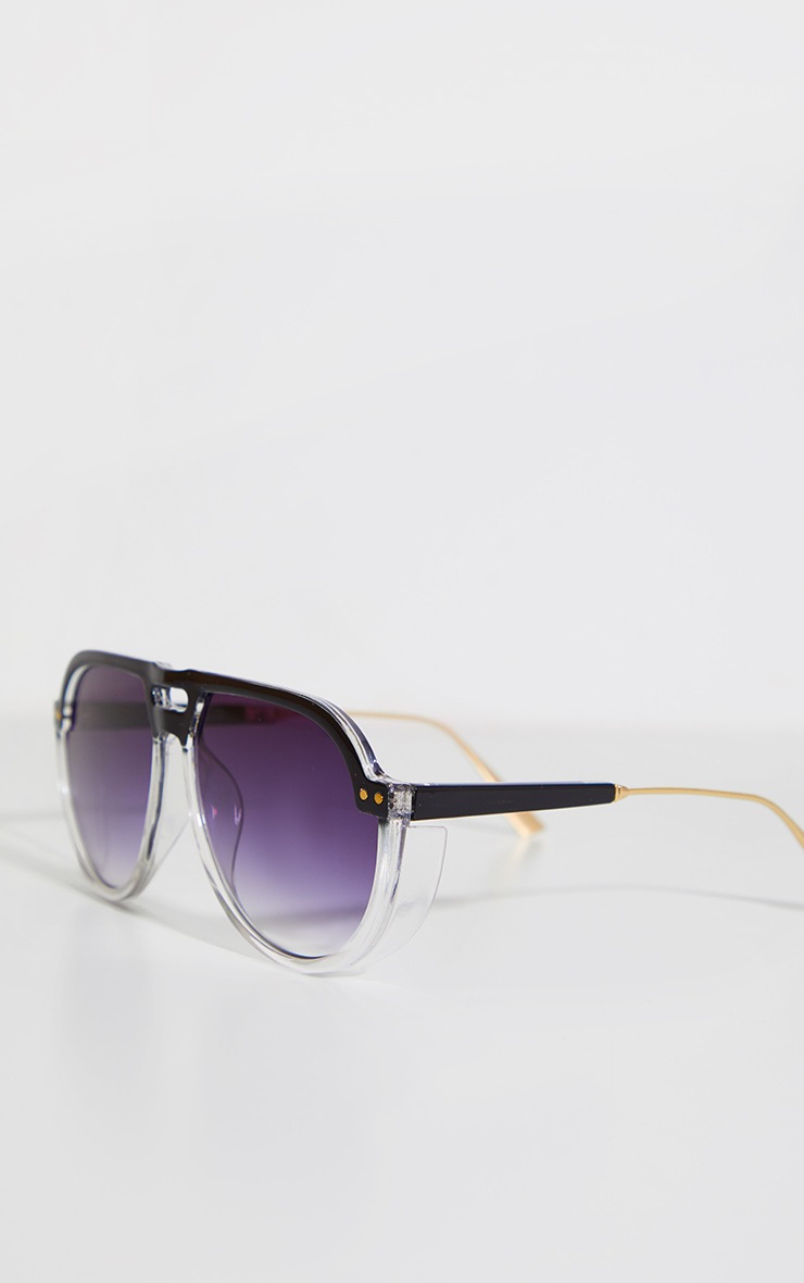 Lunettes de soleil noires rondes à verres dégradés et monture à double barre