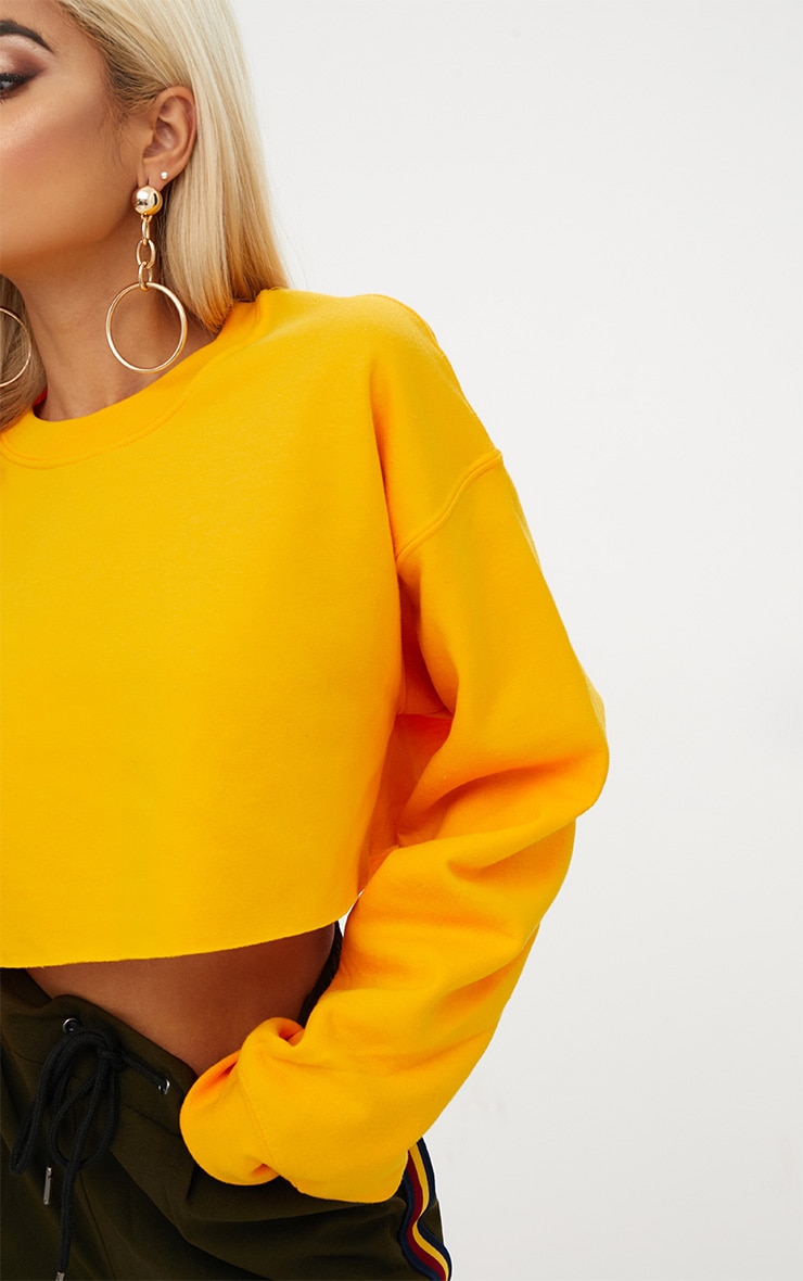 yellow cropped knit sweater