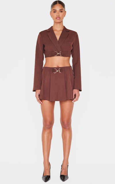 Micro jupe de tailleur tissée chocolat plissée à détail boucle