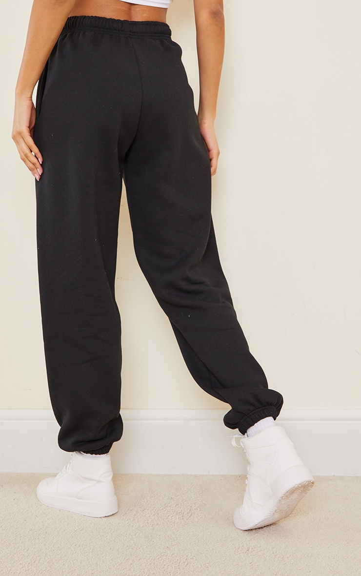 black cuffed track pants