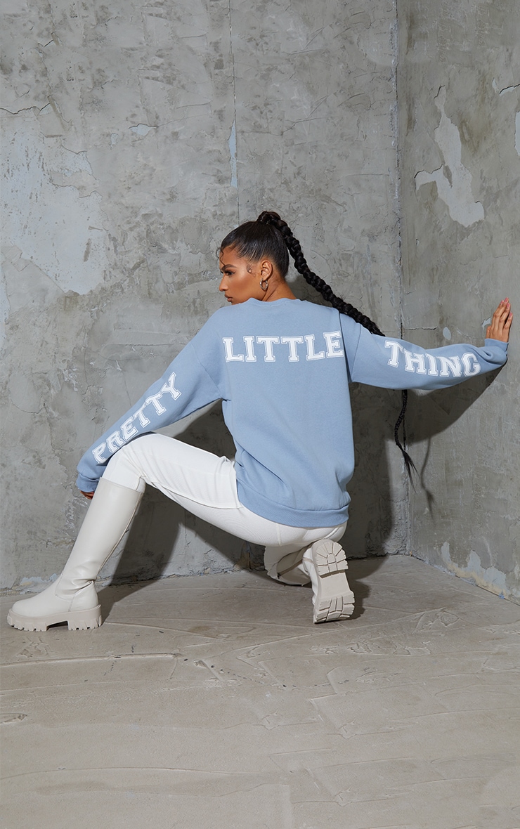 PRETTYLITTLETHING Dusty Blue Back Arm Print Slogan Sweatshirt