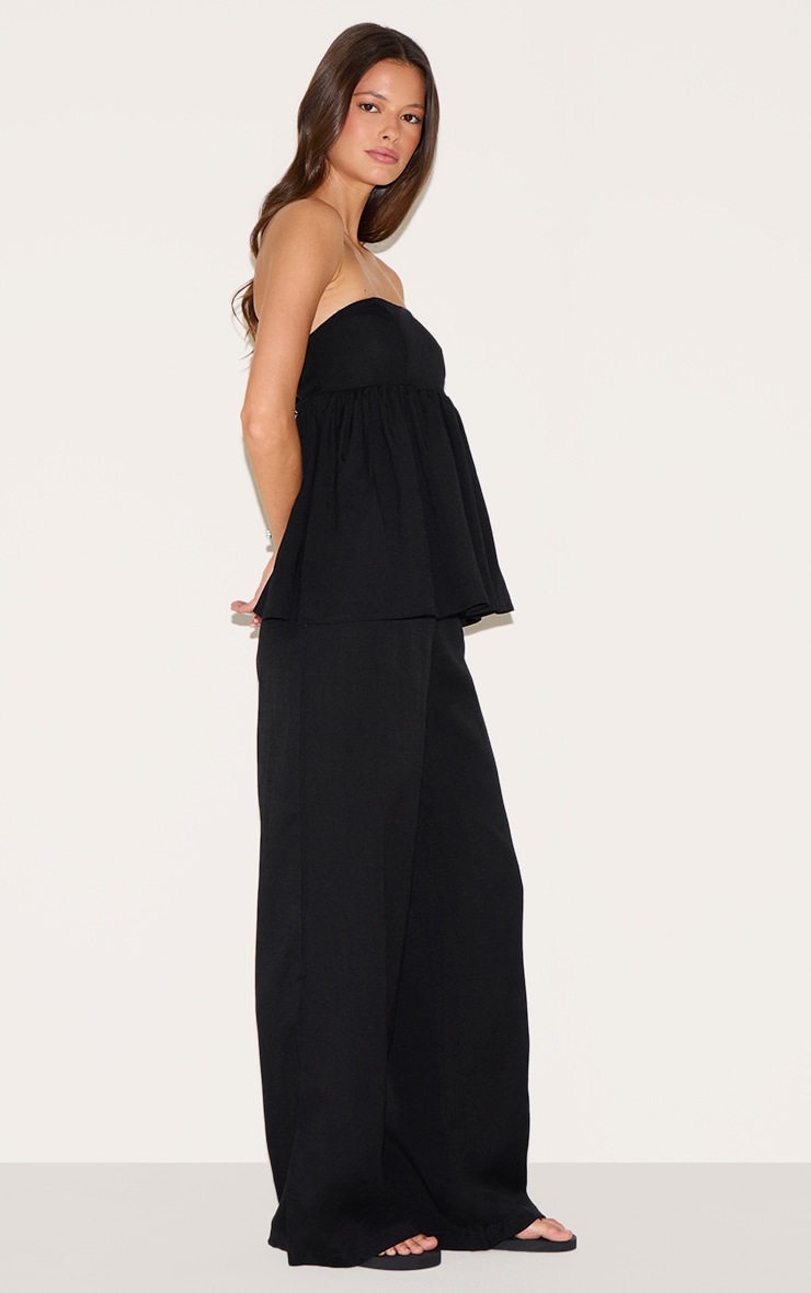 Combinaison bustier noire à détail péplum image 3