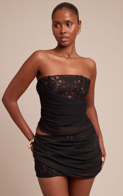 Corset noir en dentelle florale à détail drapé