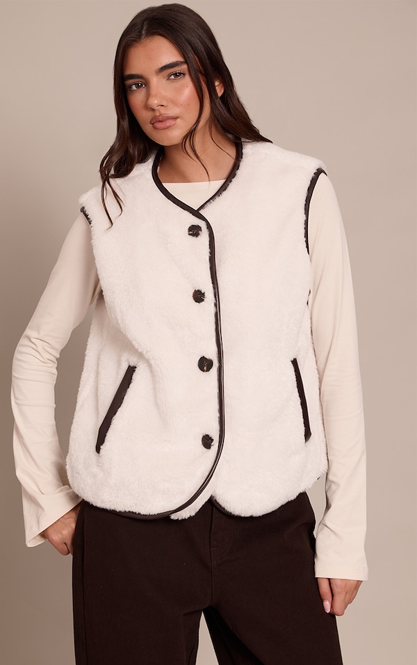 Gilet en imitation mouton crème à brodures en PU