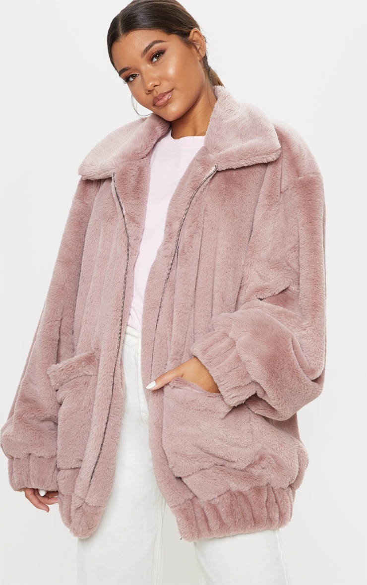 Veste fausse fourrure vieux rose à poches