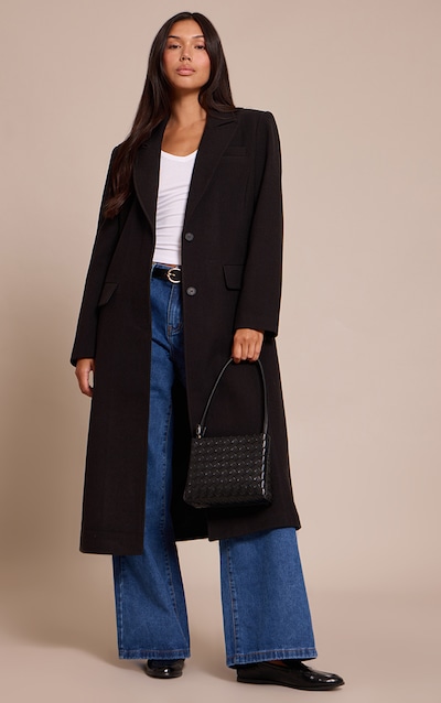 Manteau long en effet laine noir à simple boutonnière et lisérés structurants