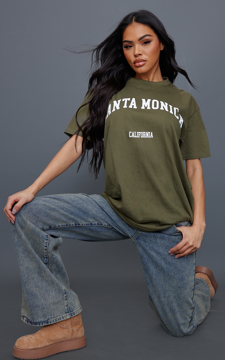 Dark Khaki Santa Monica Print T Shirt Tops PrettyLittleThing AUS dark-khaki-santa-monica-print-t-shirt-tops-prettylittlething-aus