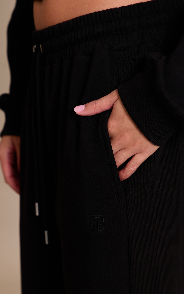 Black Embroidered Interlock Rib Panel Wide Leg Track Pants image 4