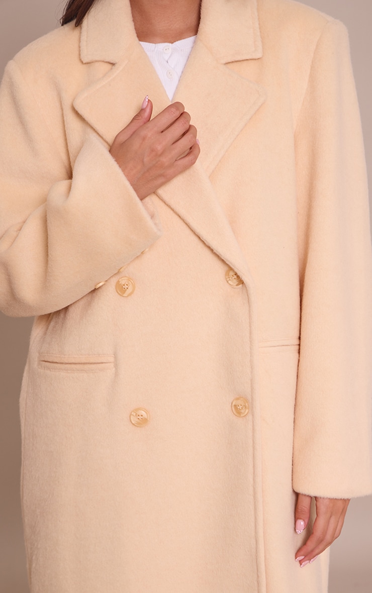 Manteau long structuré en effet laine crème au beurre à double boutonnière image 4
